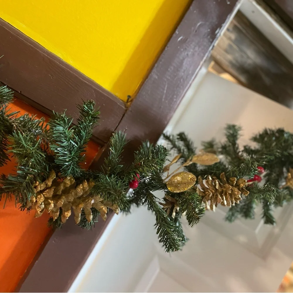 9 foot gold and silver faux evergreen garland, pine cones, berries